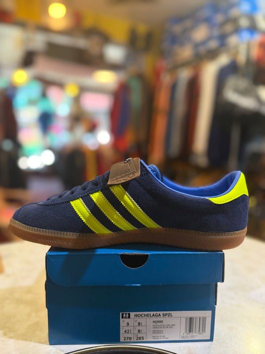 Adidas Hochelaga SPZL HQ9950 UK 8.5, navy suede with yellow Three Stripes, side view on original box