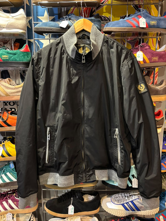 Front view of black Belstaff jacket with grey ribbed trim