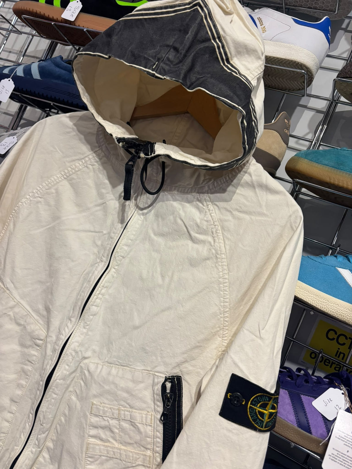 Stone Island jacket hood panel and compass badge detail