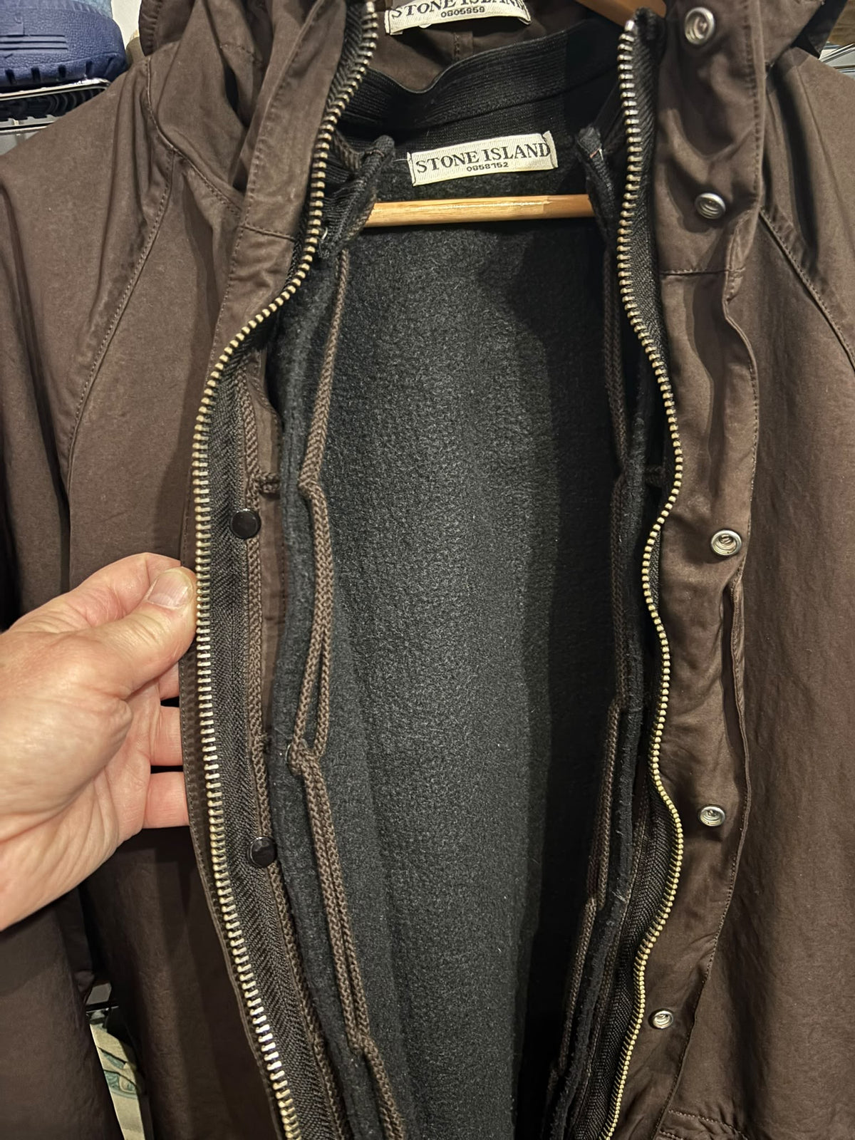 Stone Island parka detachable fleece lining and interior attachment detail