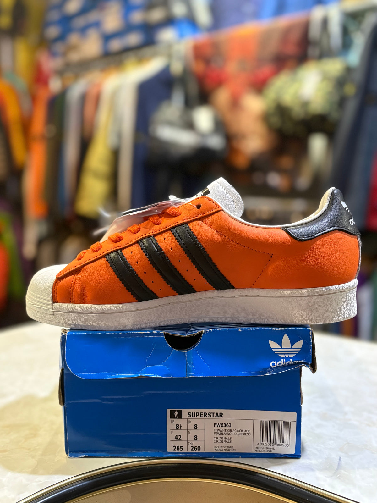 Adidas Superstar FW6363 UK 8, orange panel with black Three Stripes on original box