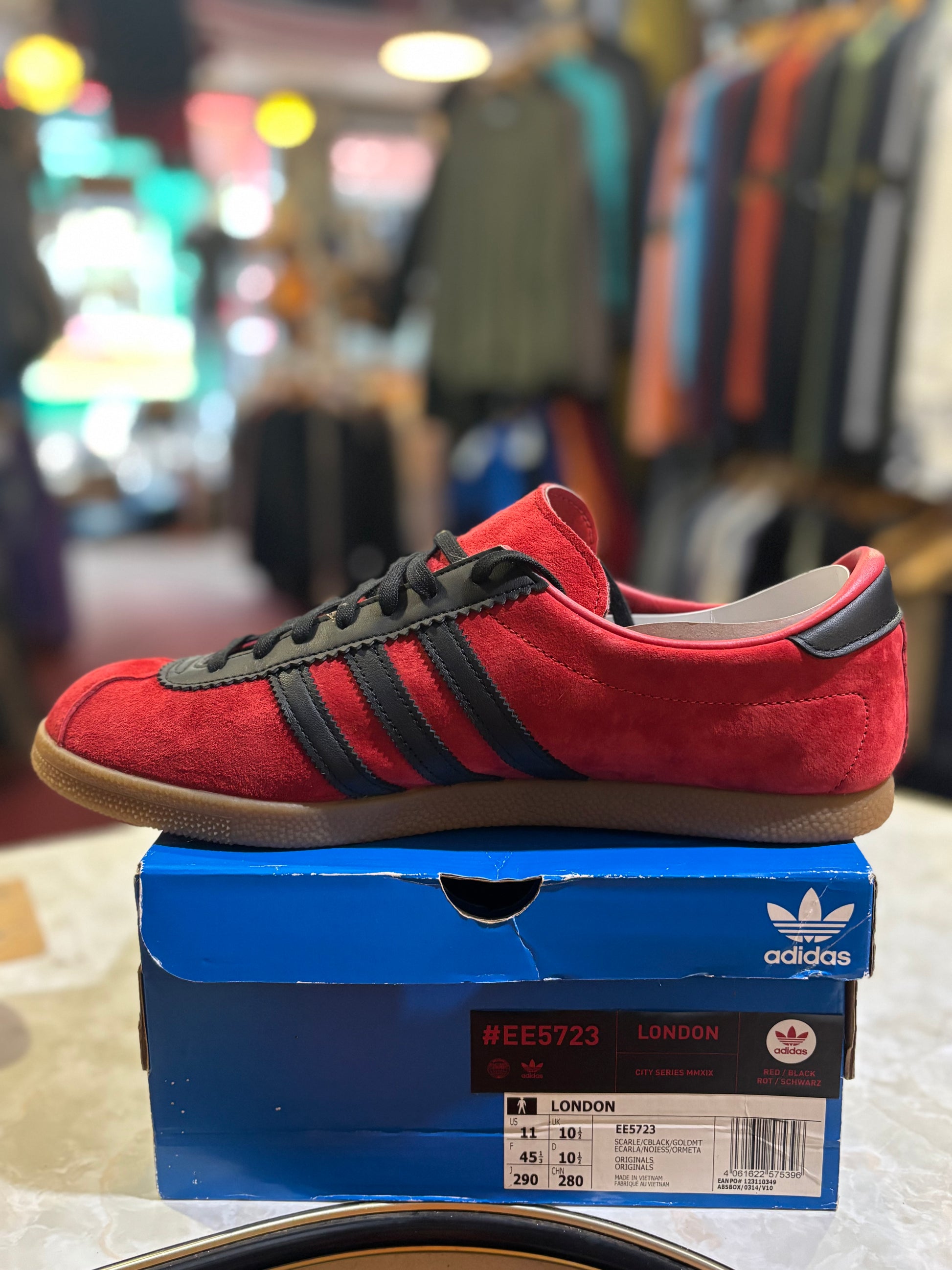 Adidas Originals London EE5723 Scarlet Black - Clean side profile on blue city series box