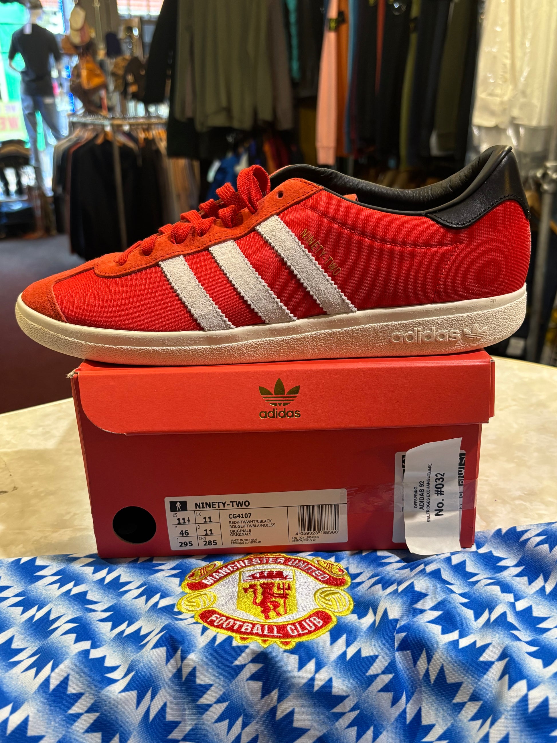Adidas Ninety-Two CG4107 Red White Black UK 11 - Side View with Man United Shirt