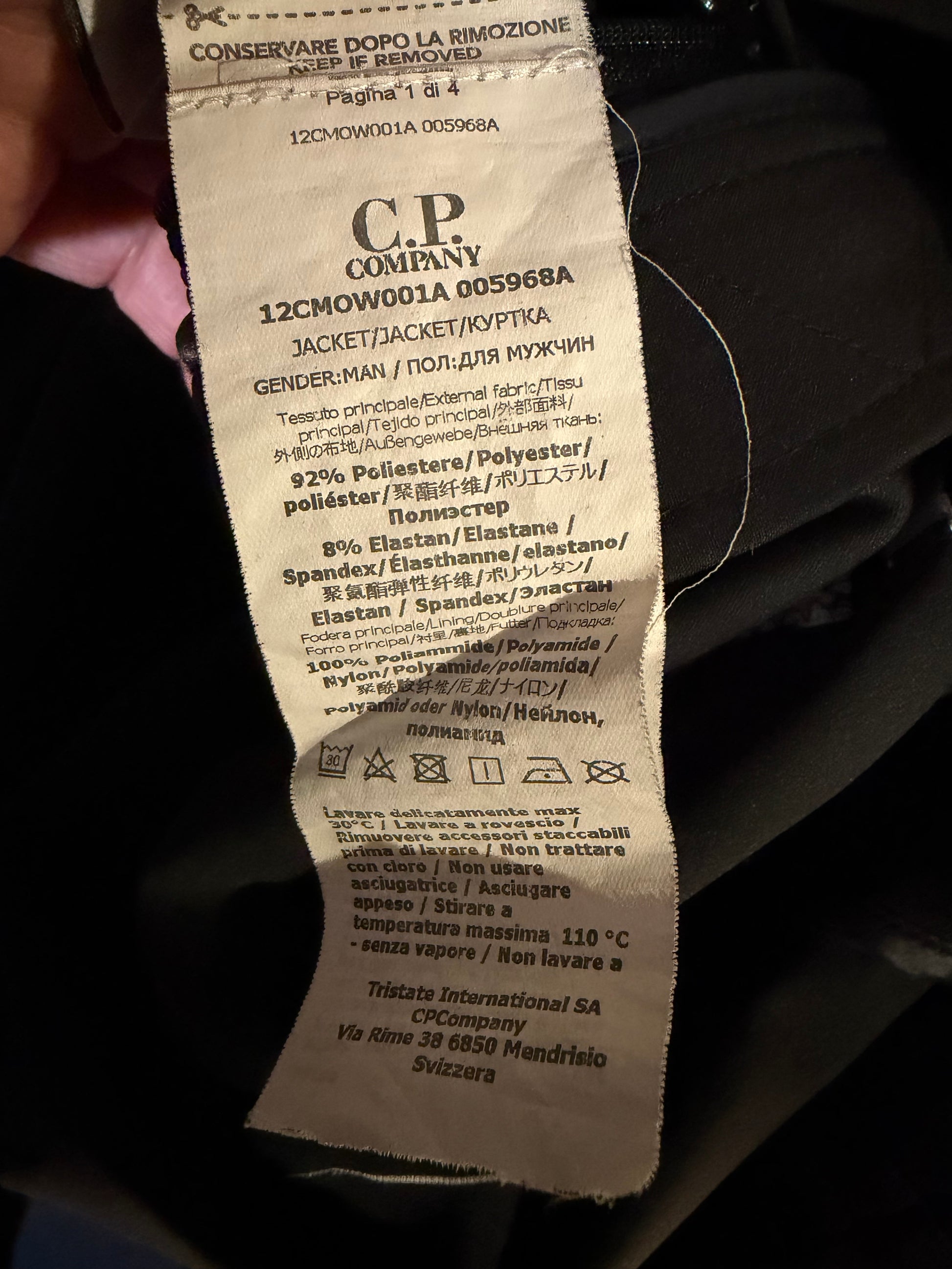 C.P. Company garment label - 12CMOW001A 005968A, 92% Polyester 8% Elastane