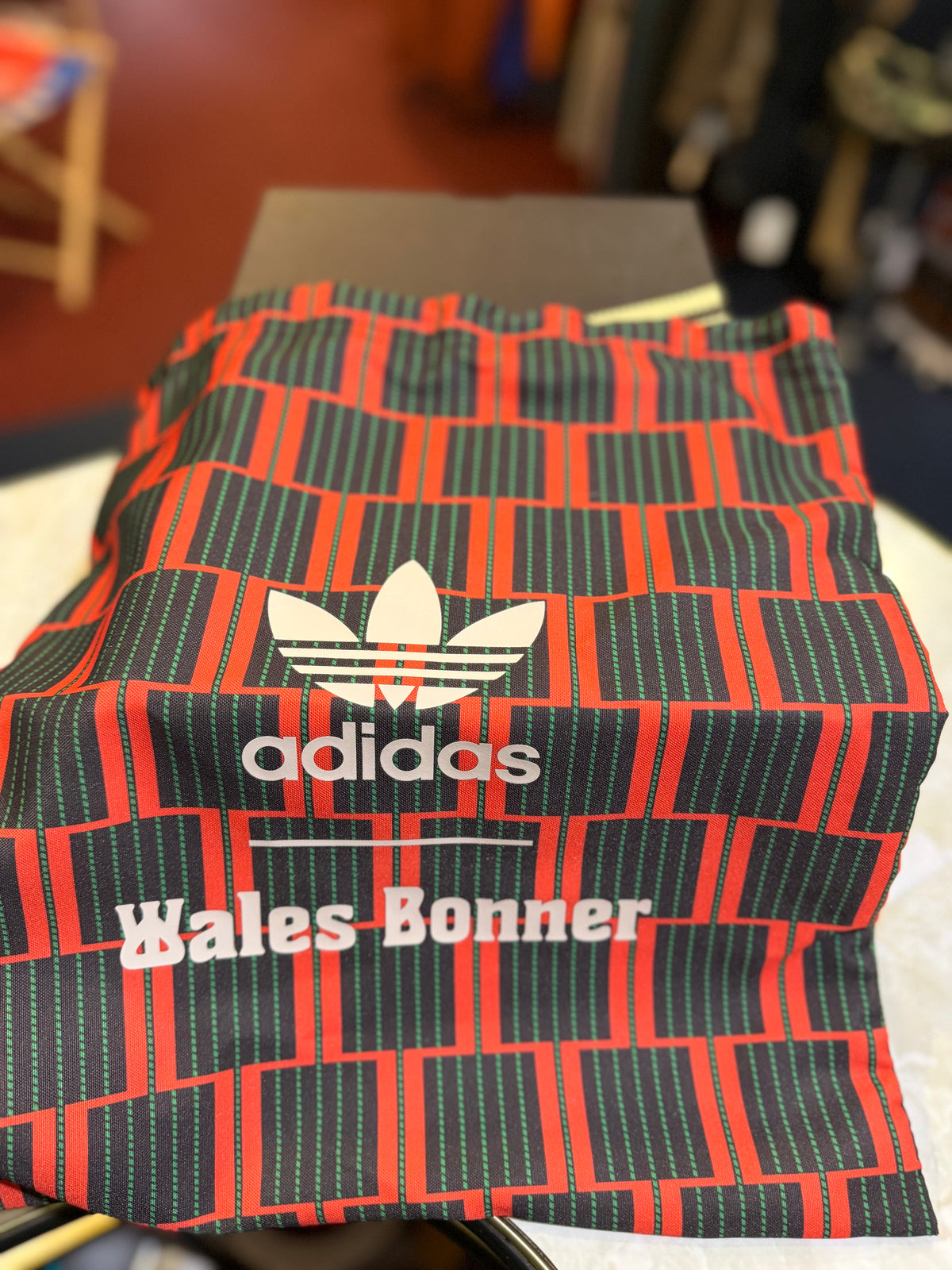 Geometrically patterned Adidas x Wales Bonner co-branded dust bag included with the SL72 Knit trainers