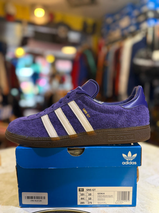Adidas SNS GT GZ3616 UK 10, purple hairy suede with white Three Stripes and gold SNS GT lettering, on original box