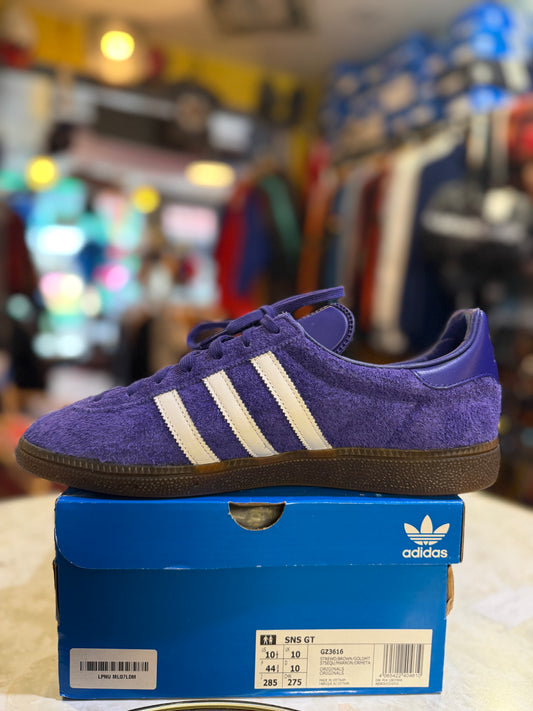 Adidas SNS GT GZ3616 UK 10 in purple and white with dark gum sole, alternate side view on original box