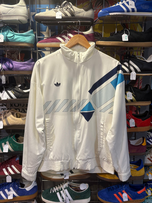 Adidas Originals vintage track top off-white cream - front view showing geometric navy and sky blue graphic panel and trefoil badge