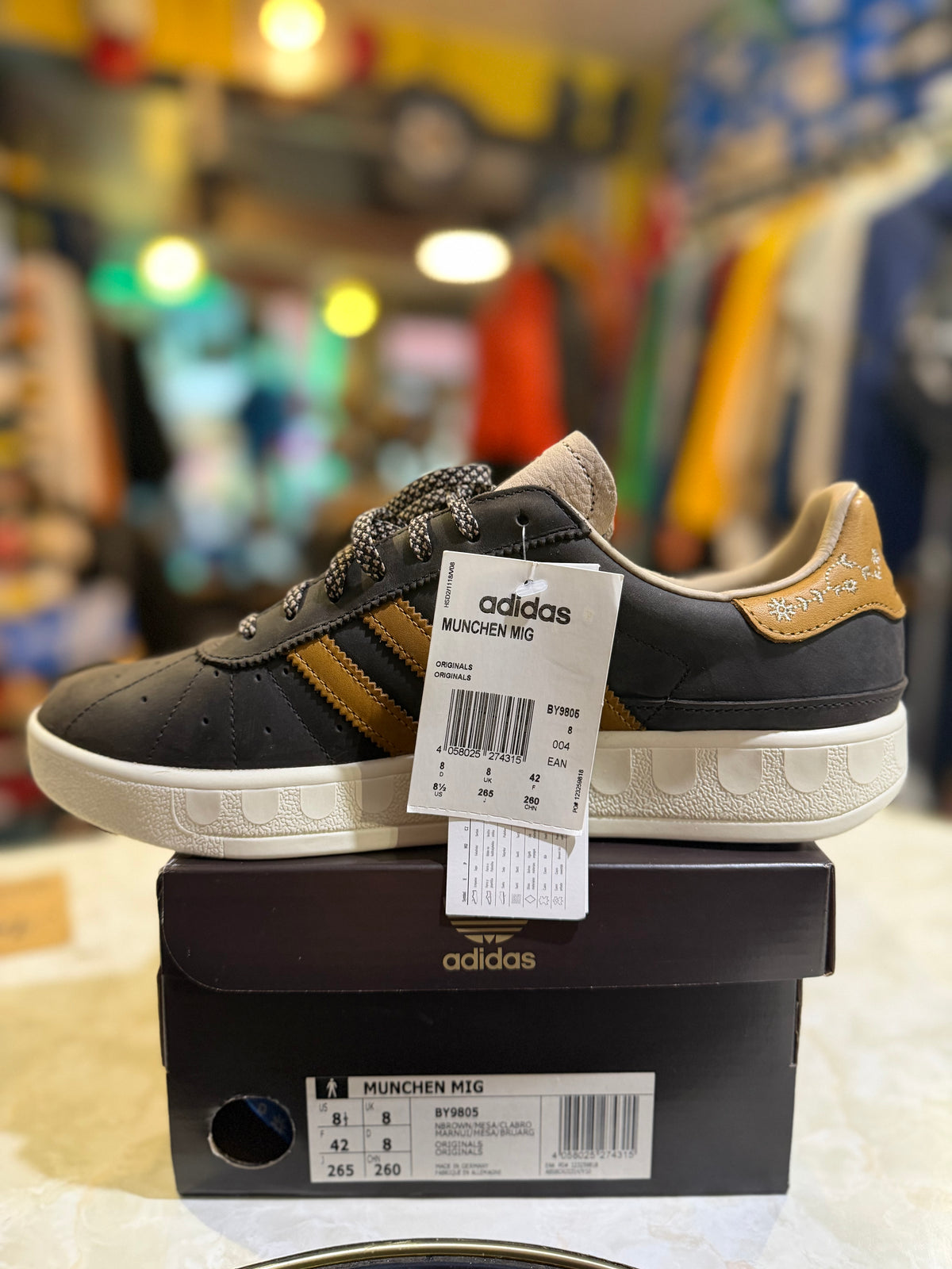 Adidas Munchen MiG BY9805 UK 8, heel three-quarter view on box with hangtag