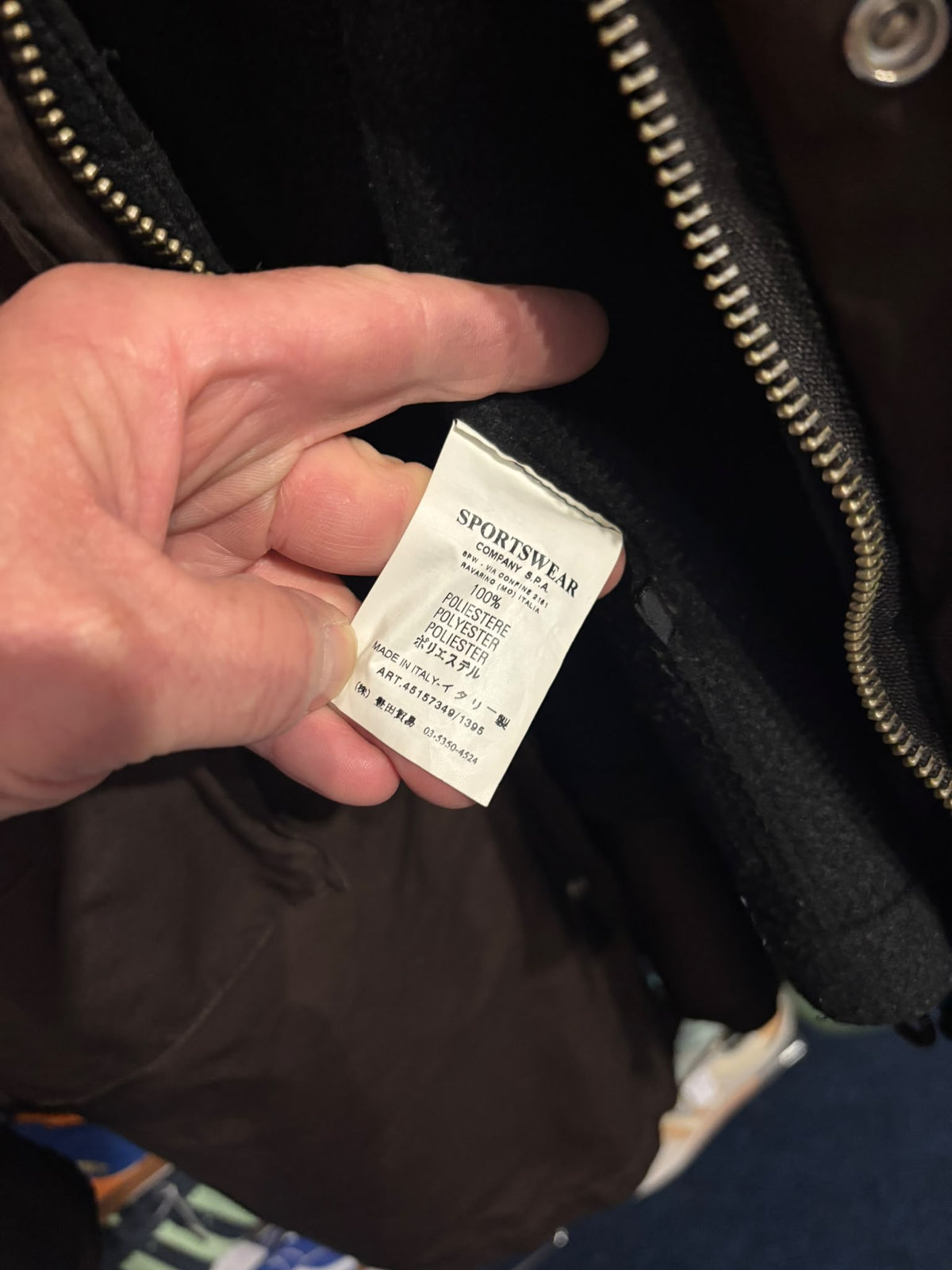 Stone Island polyester shell care label and article number